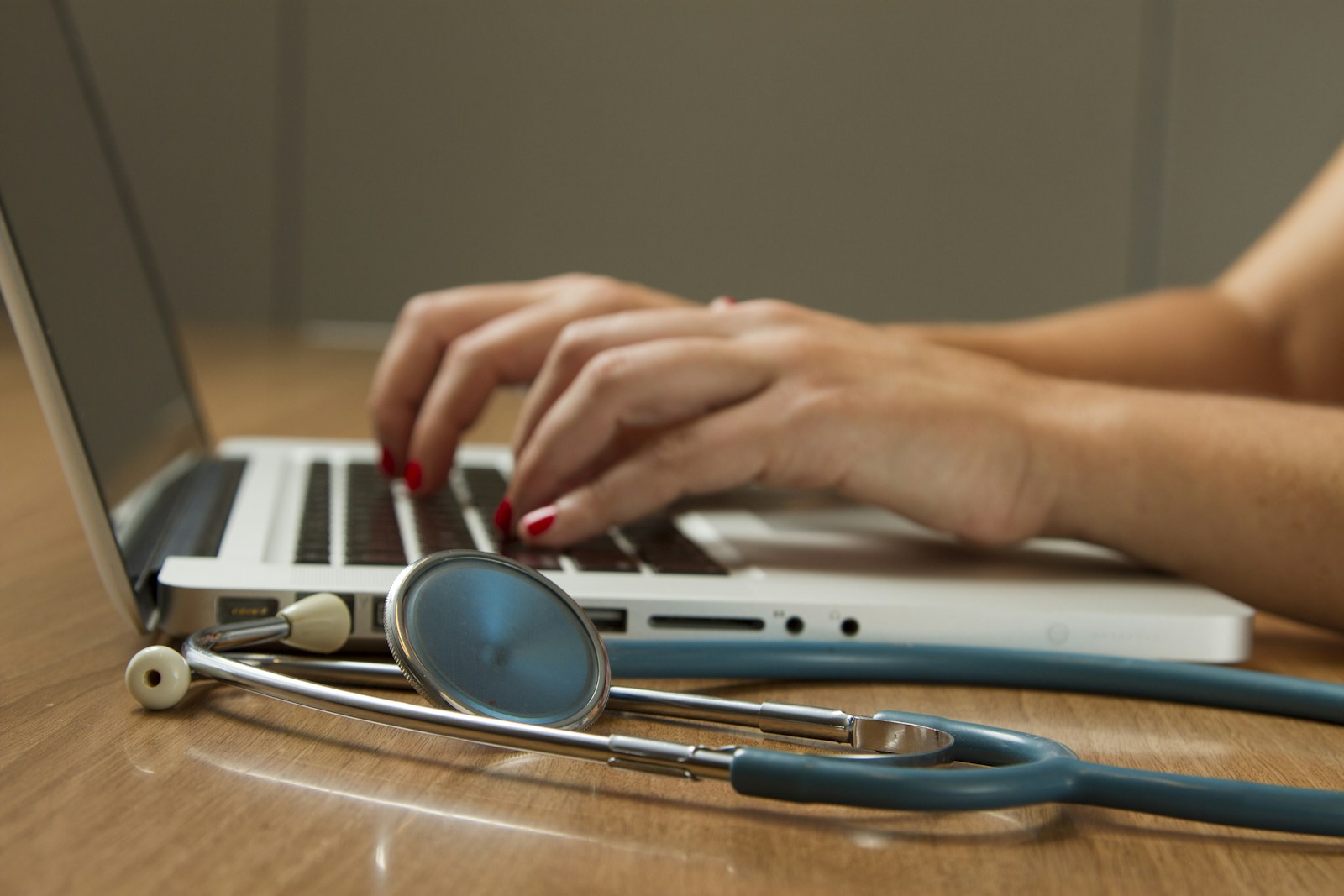 A healthcare professional working with digital technology.